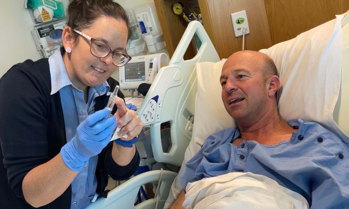 A photo of a nurse talking through a healthcare process with a patient at The Wesley A photo of a nurse talking through a healthcare process with a patient at The Wesley