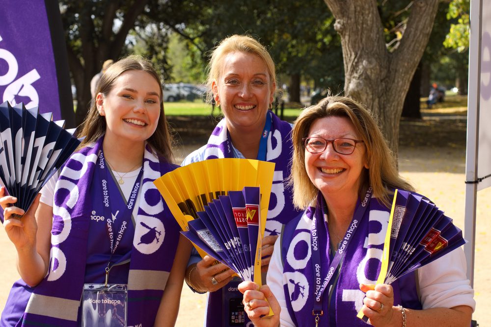 volunteers with fans